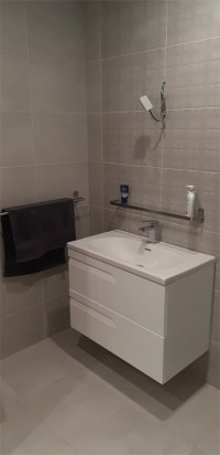 Wall hung white vanity unit in a Cavan home - bathroom installation  by North West Tiles & Timber, Leitrim, Ireland