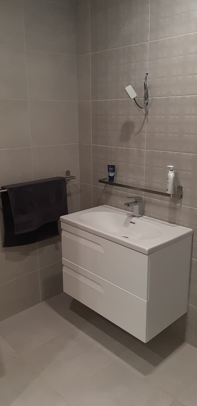 Wall hung white vanity unit - new bathroom installation in a  Cavan home  by North West Tiles & Timber, Ireland